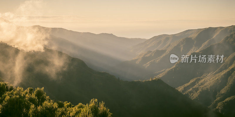 Clouds over the mountains near Rabaçal on Madeira island during sunset